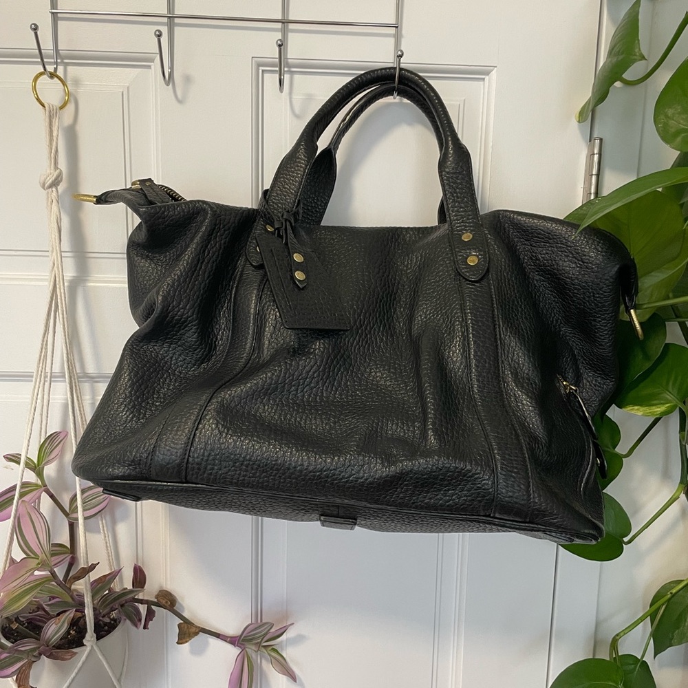 Cole Haan black leather travel duffel bag.